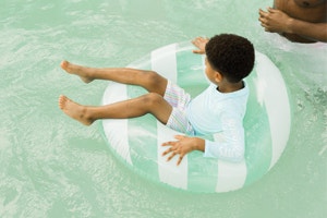 little boy on a life buoy