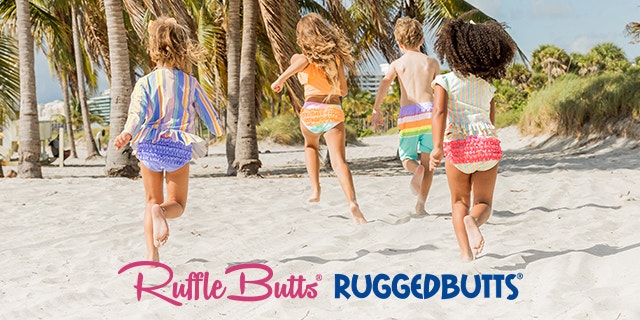 Rufflebutts Wholesale Application Header - 4 Children on a beach